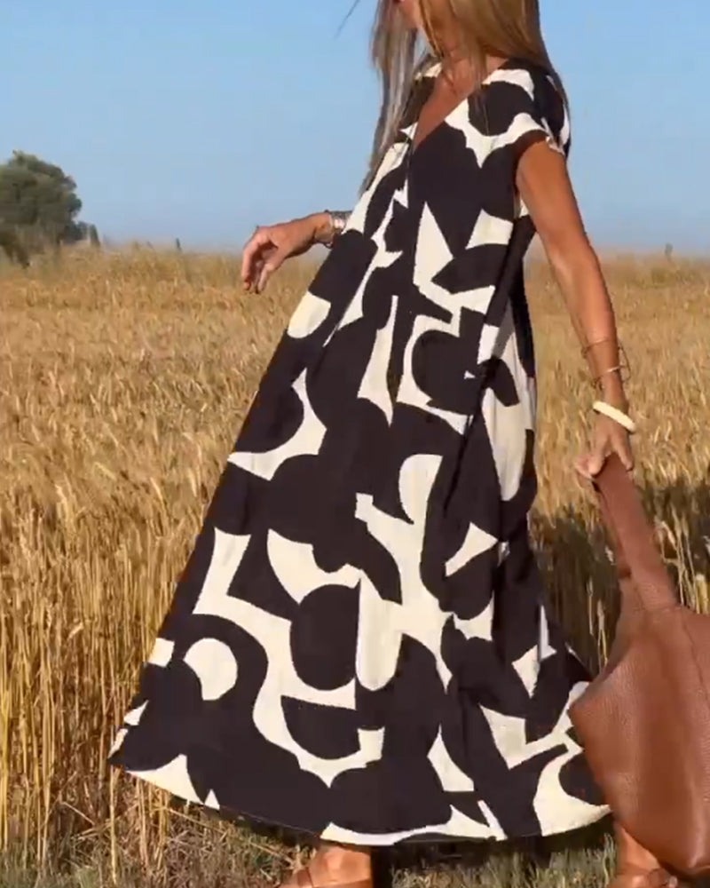 SITA - Dress with print and V-neckline