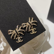 CC Crystals Black Enamel Bow Gold Earrings